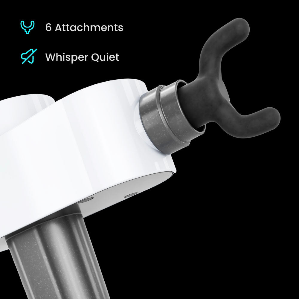 Massage device attachment with a black rubber tip, white body, and metal connector, showcasing design features.